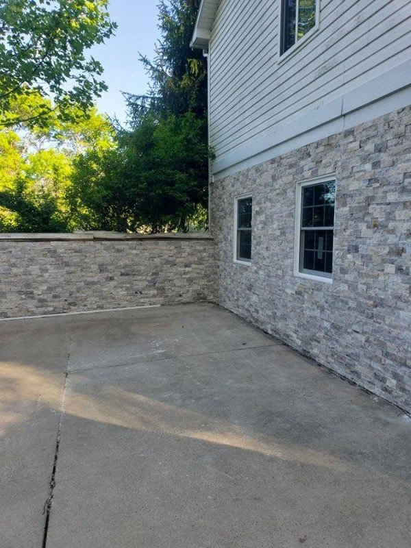 Stone veneer on a house foundation wall